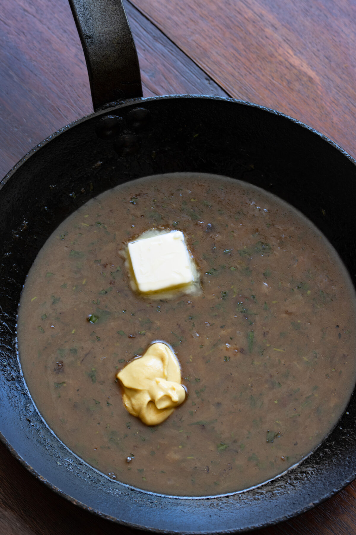 Dijon mustard and butter whisked into the beer gravy off the heat