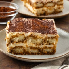 Slice of tiramisu served on a dessert plate.