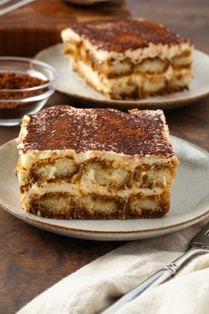 Slice of tiramisu served on a dessert plate.