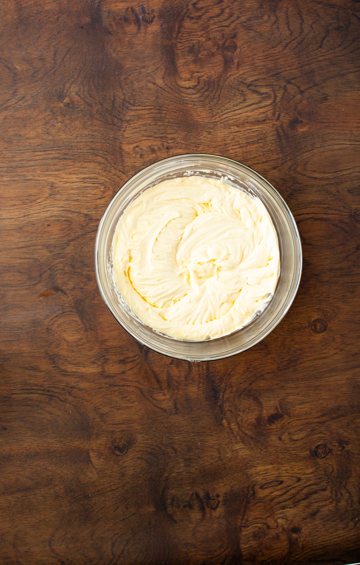 Egg yolks whipped beat with sugar to create a creamy mixture. Mascarpone is added and mixed gently until well inccorporated. 