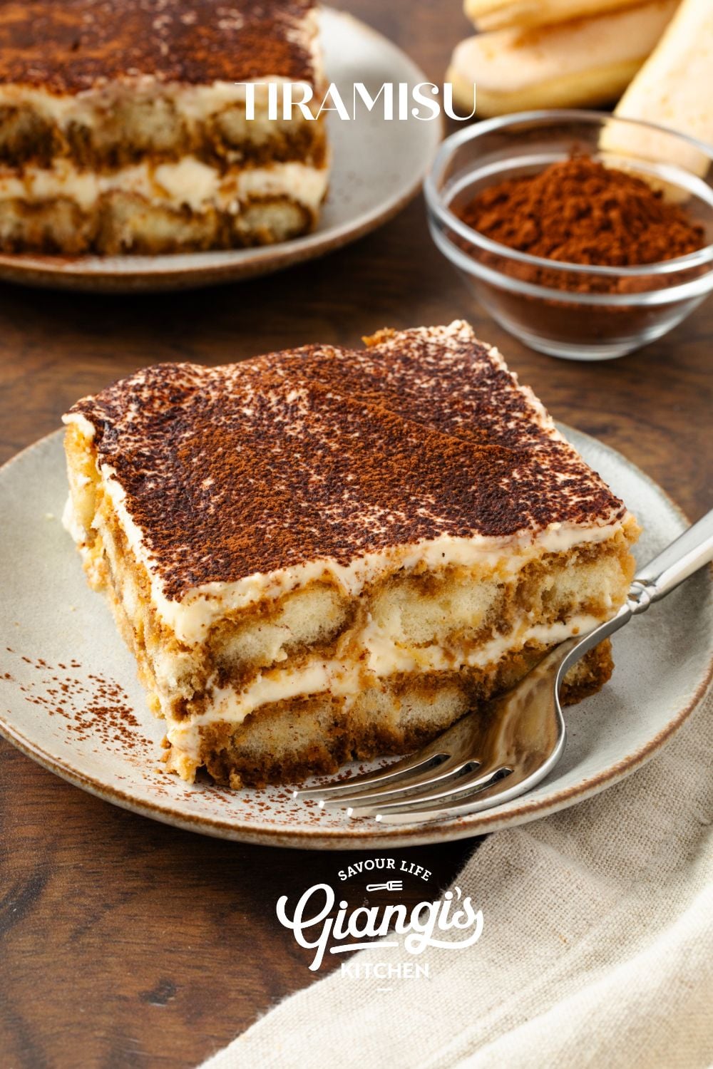 Slice of tiramisu served on a dessert plate.