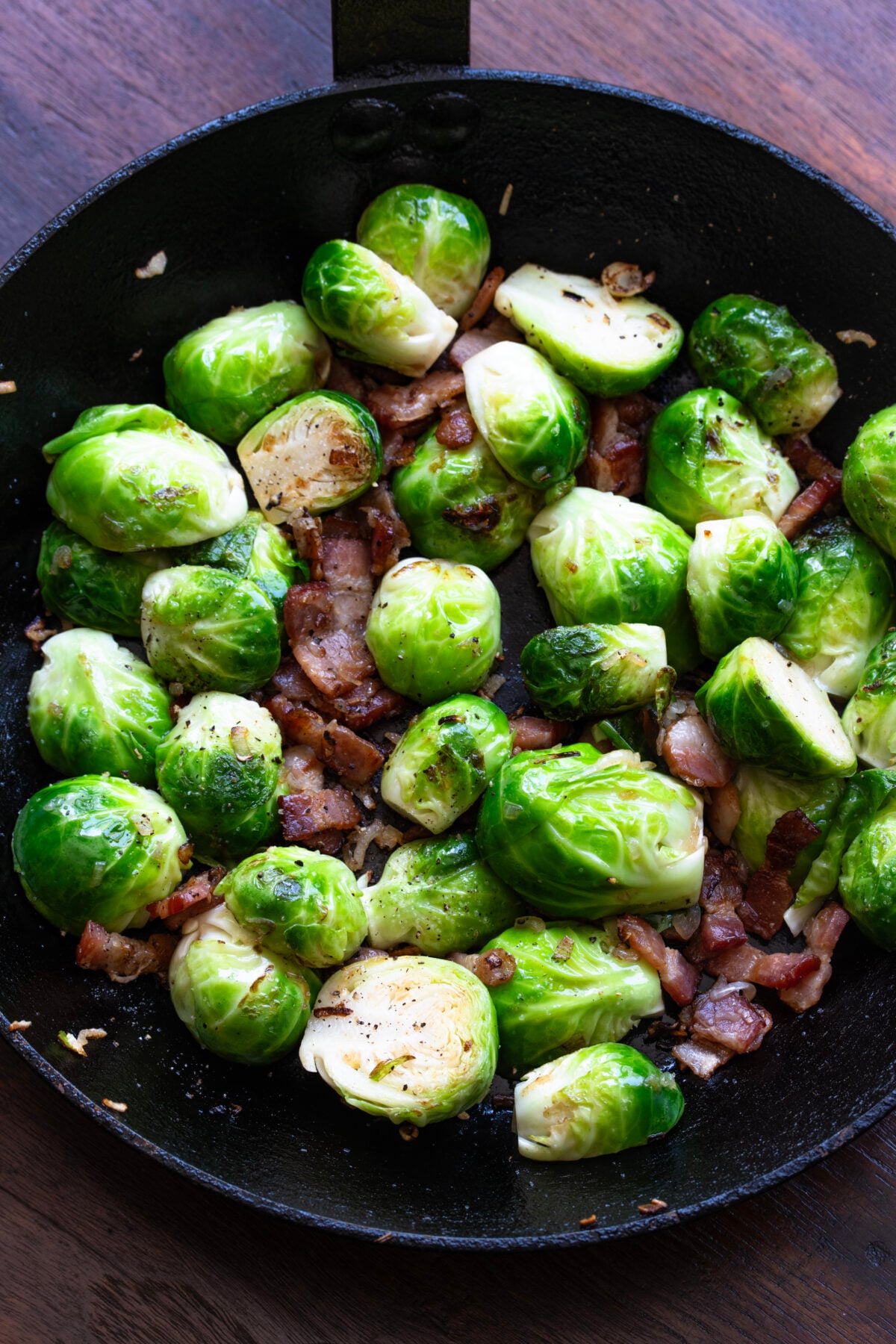 Season with salt and black pepper, keeping in mind that the bacon is already salty.