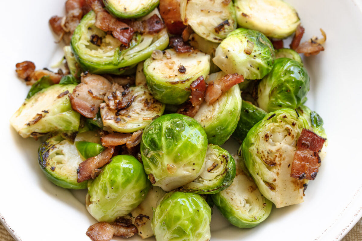 Close up of the Brussels sprouts with crispy bacon and shallots.