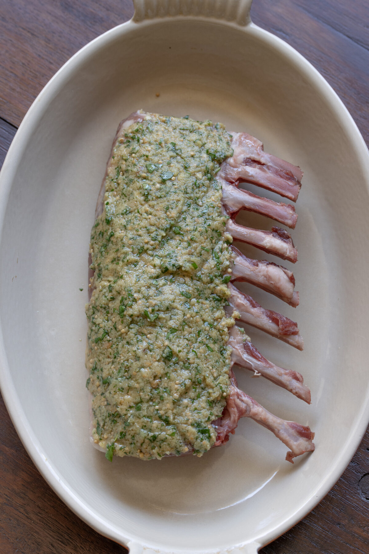Herb crust placed over the rack of lamb.
