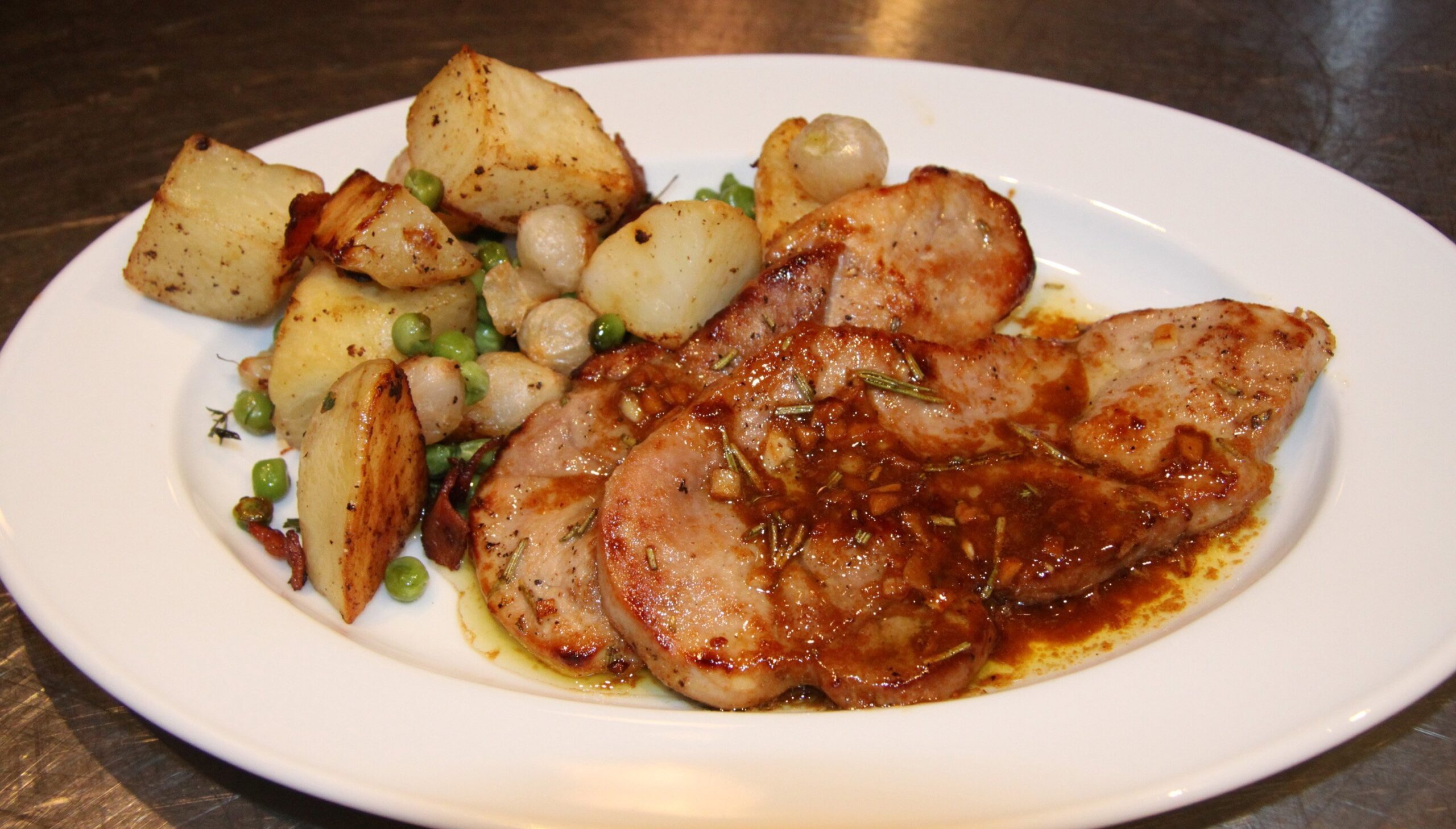 white balsamic pork chops with roasted potaotes and peas
