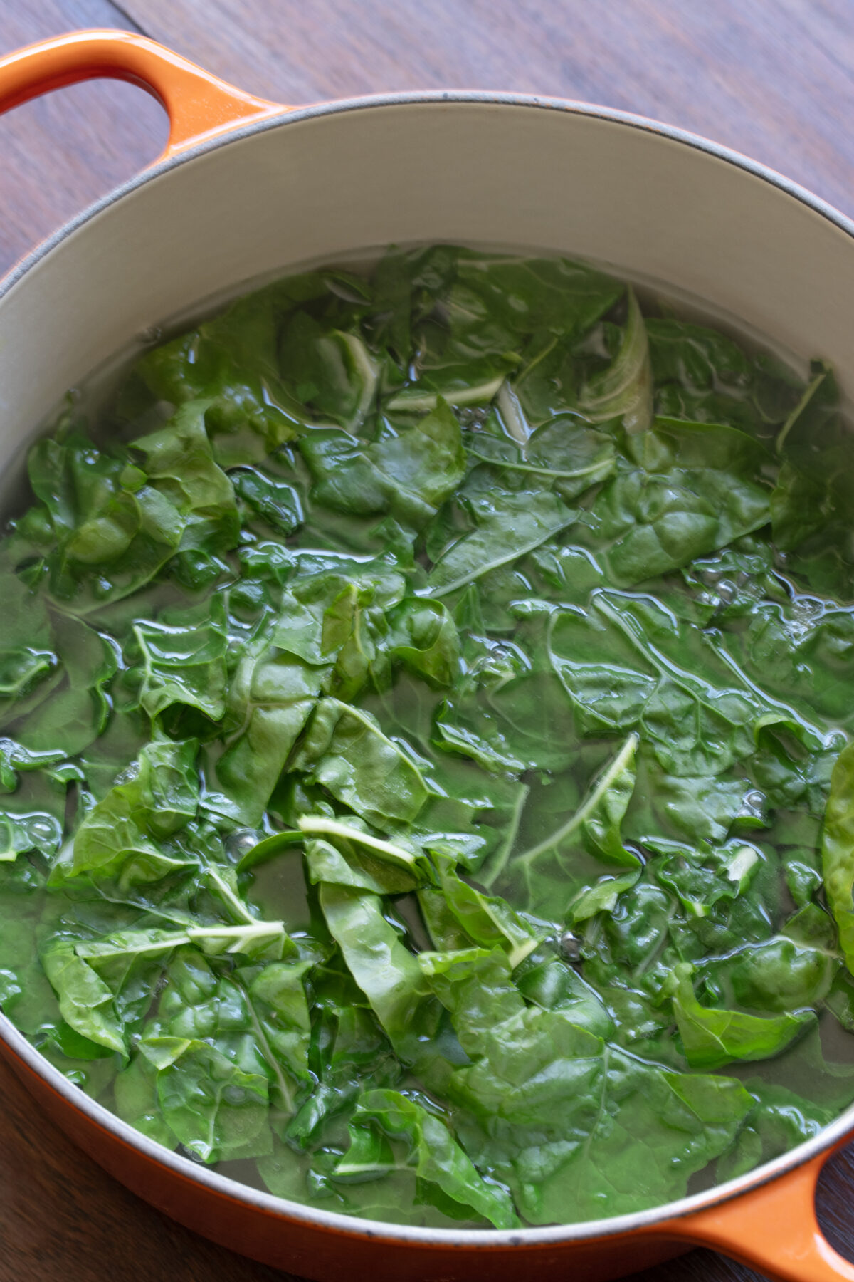 Blanching the chard in a large pot of salted water.