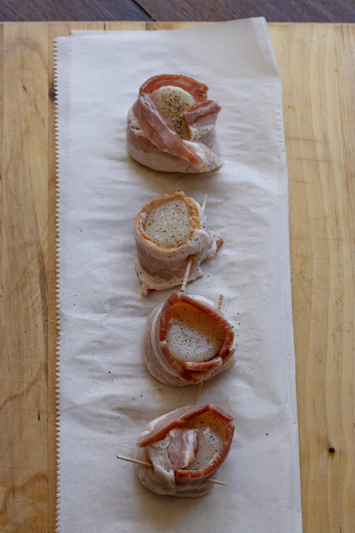 Bacon wrapped around scallops.