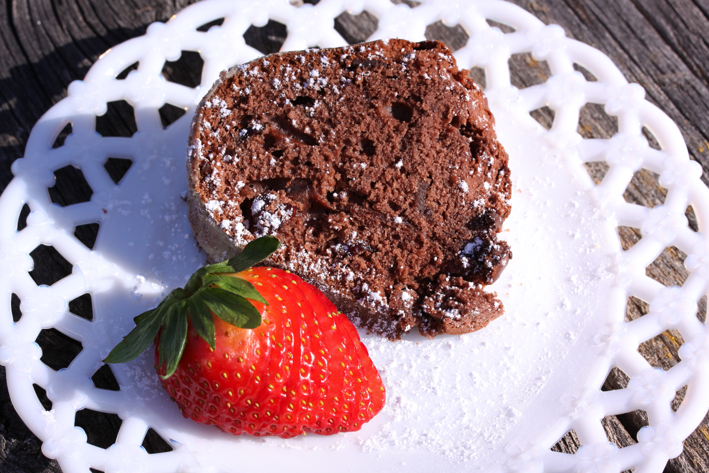 slice of chocolate pound cake on a white plate