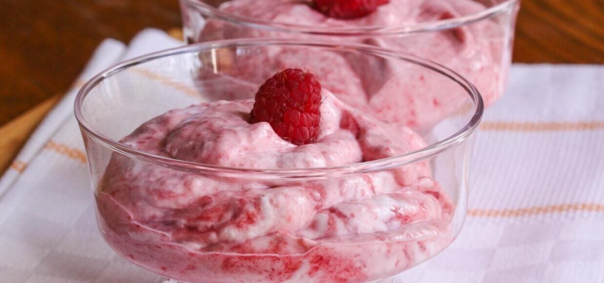 raspberry fool served into glass cups.