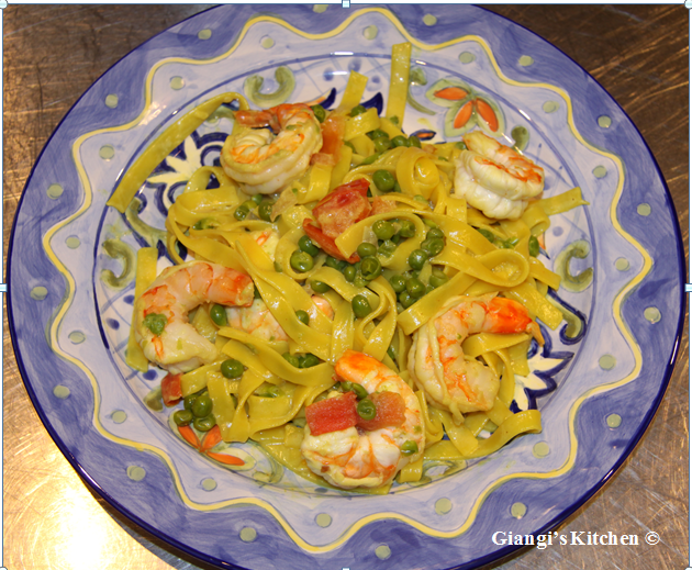 fettuccine with prawns, peas, tomatoes and cream sauce