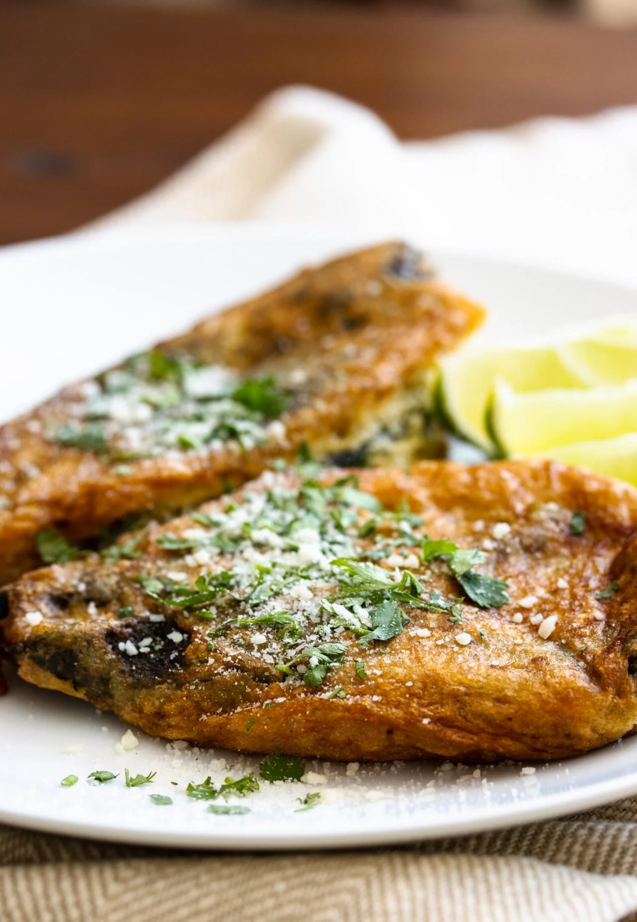 Chiles Rellenos Dish is serve on a white serving plate