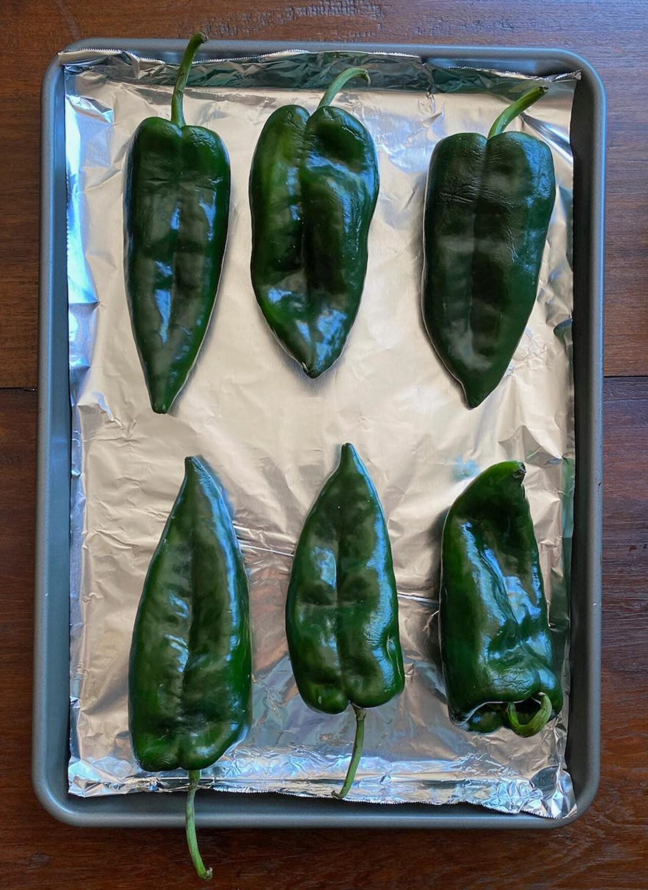 Chiles Rellenos Roasting the rellenos.