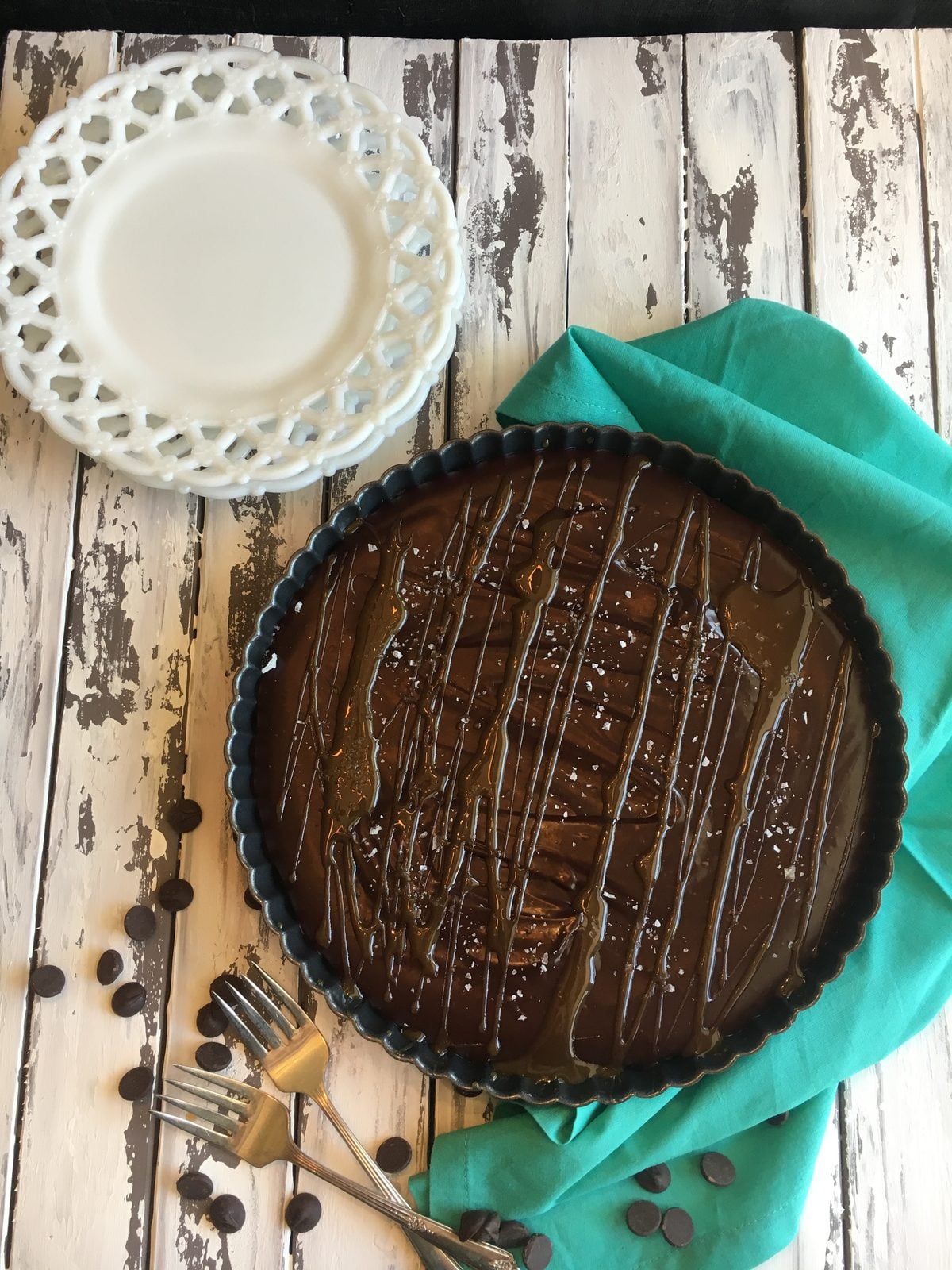 Dark chocolate ganache tart in the pie mold and ready to be enjoyed