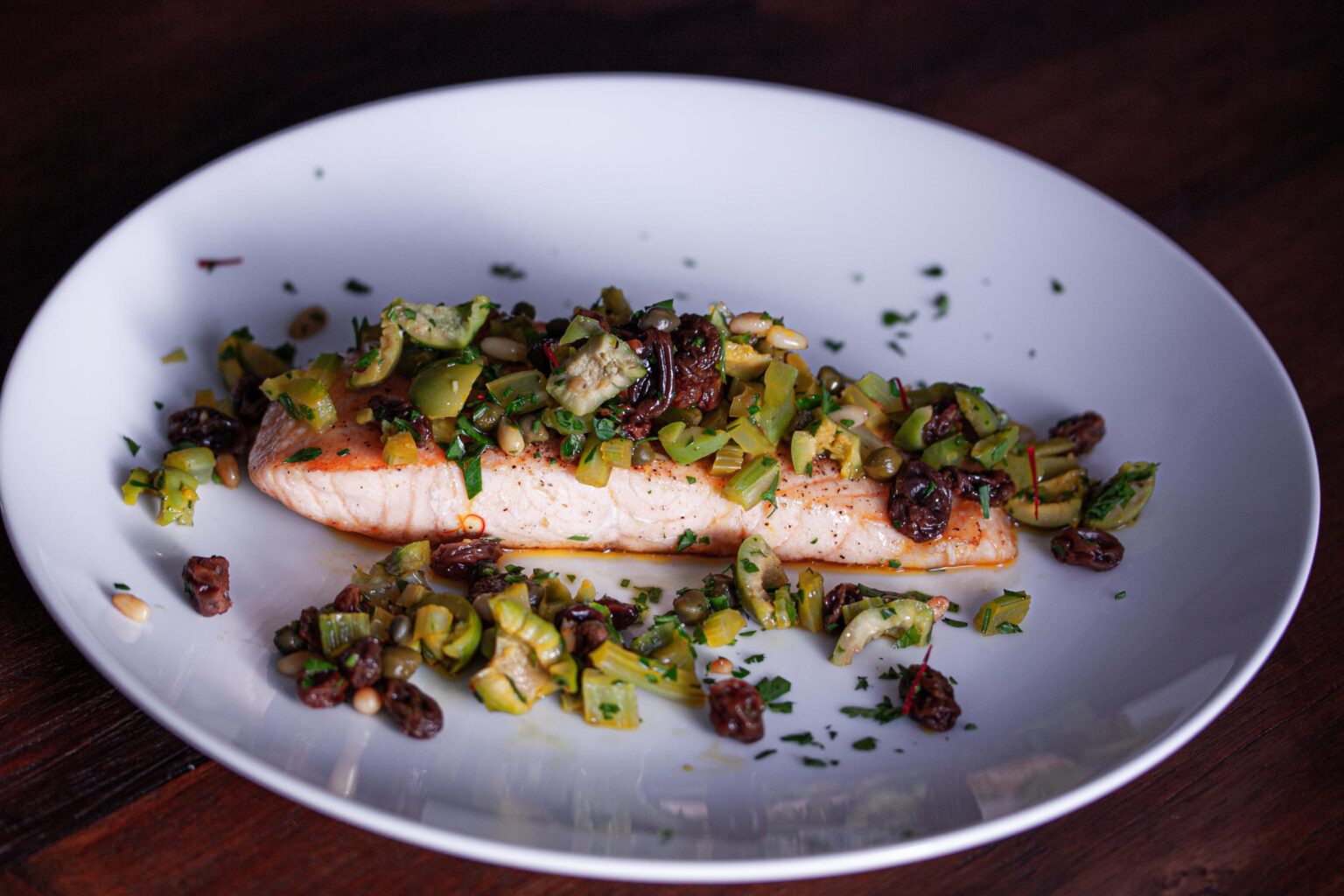 grilled salmon with olives and pine nuts