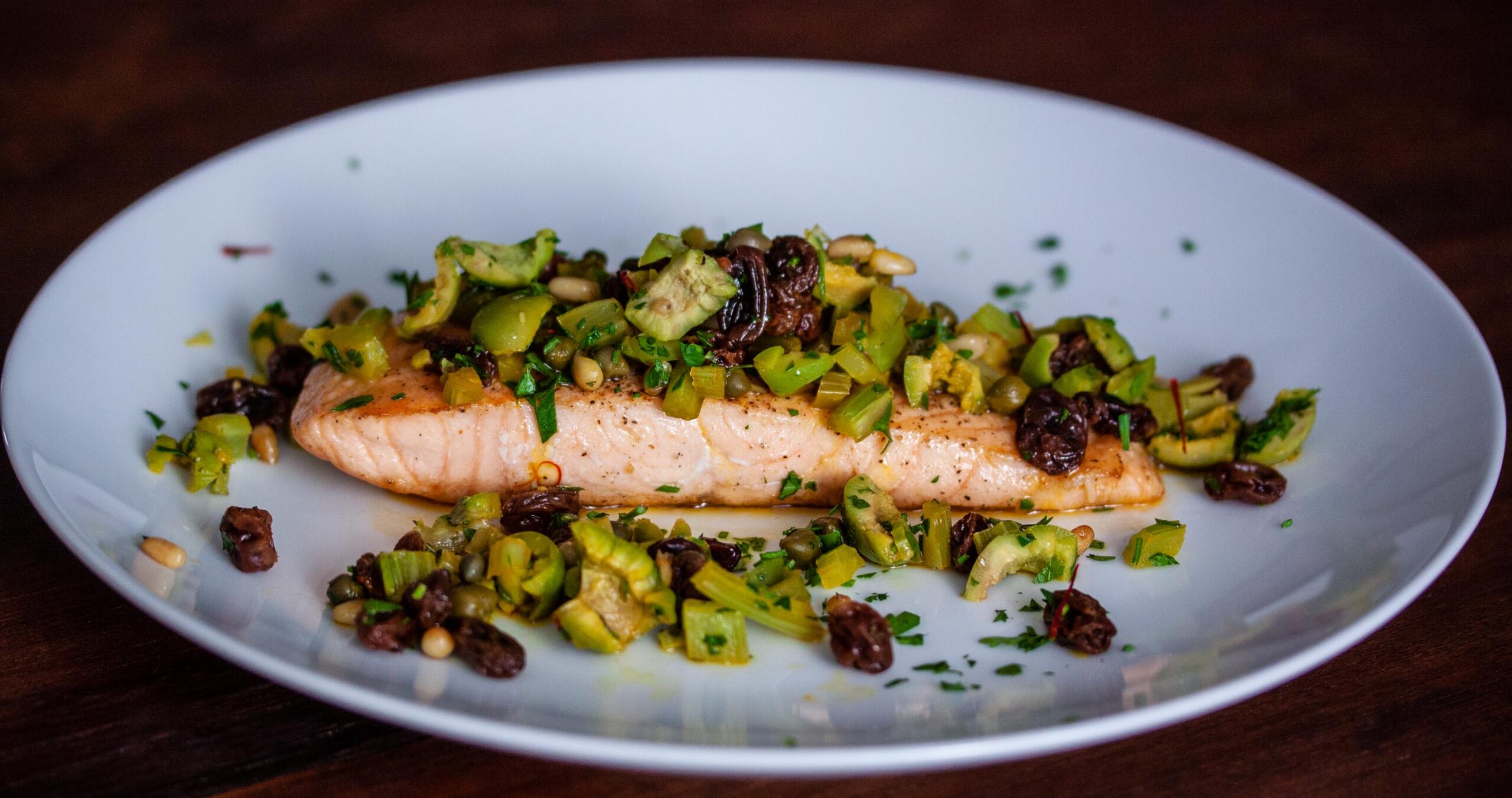 grilled salmon with olives and pine nuts