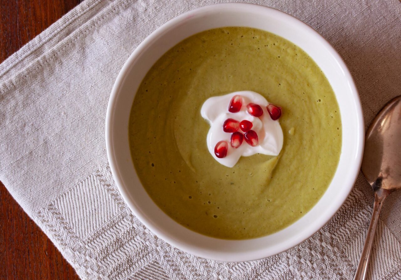 avocado soup avocado soup served with sour cream aand pomegranate.
