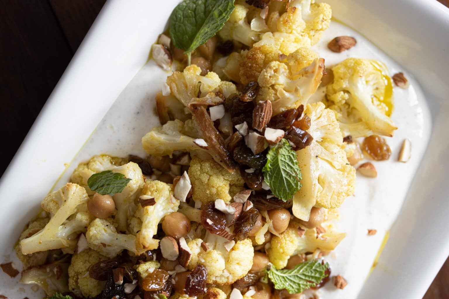 Close up of the curry chickpea salad with the almond, and fresh mint.