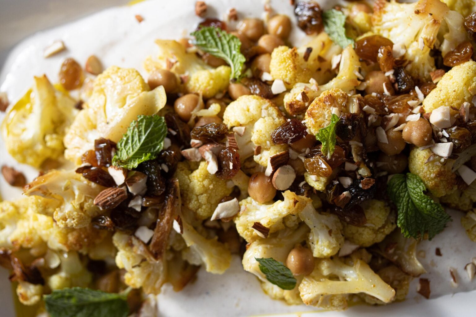 Cauliflower curry recipe close up on a white serving dish