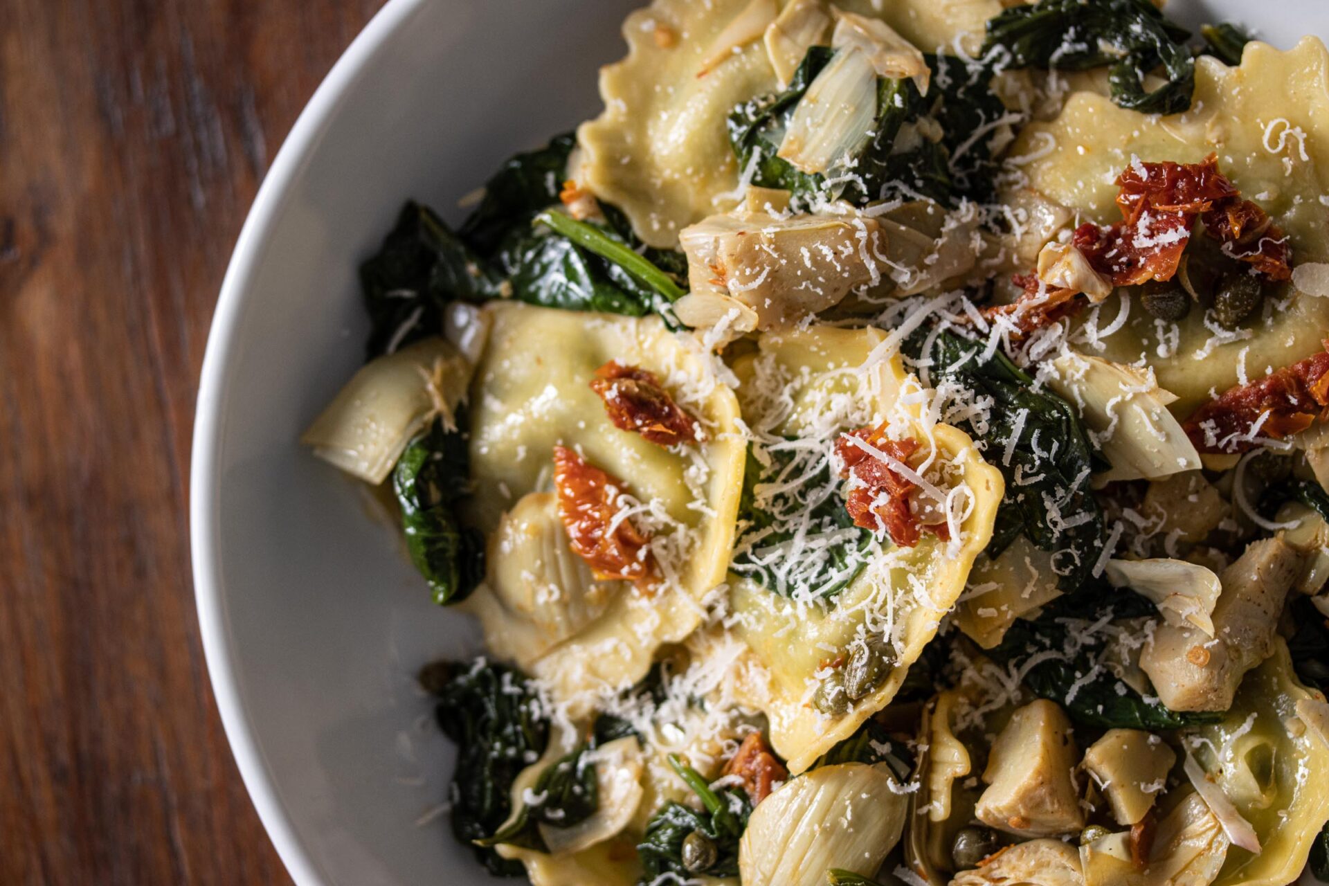 ravioli with asparagus hearts, capers, sun-dried tomatoes, spinach