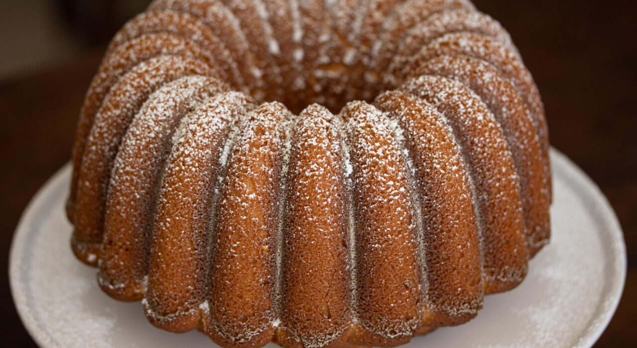Lemon Pound Cake lemon pound cake unmolded on a white plate