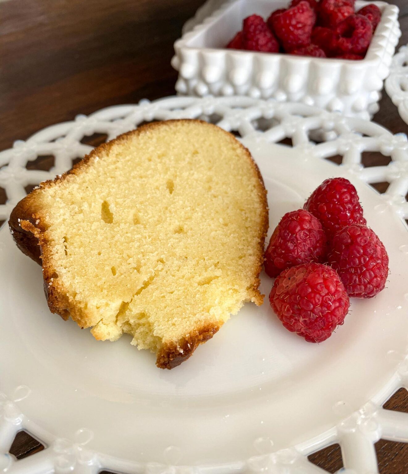 lemon pound cake lemon pound cake sliced and served with raspberries