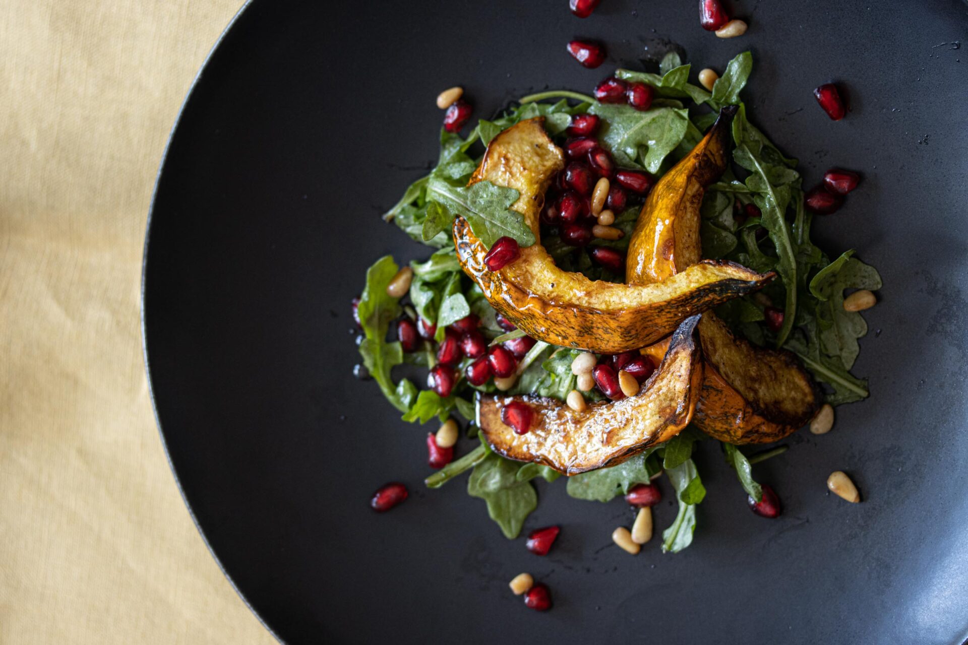 pomegranate acorn squash arugula salad