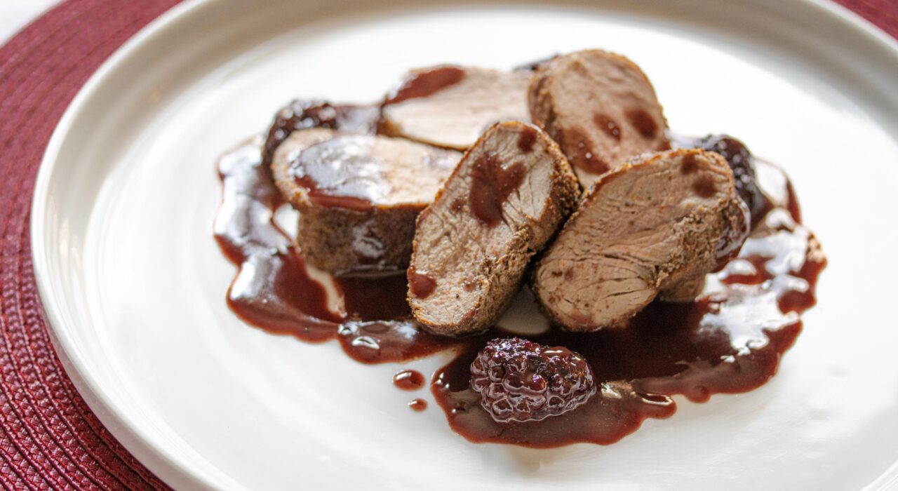 pomegranate, blackberries sauce with pork tenderloin