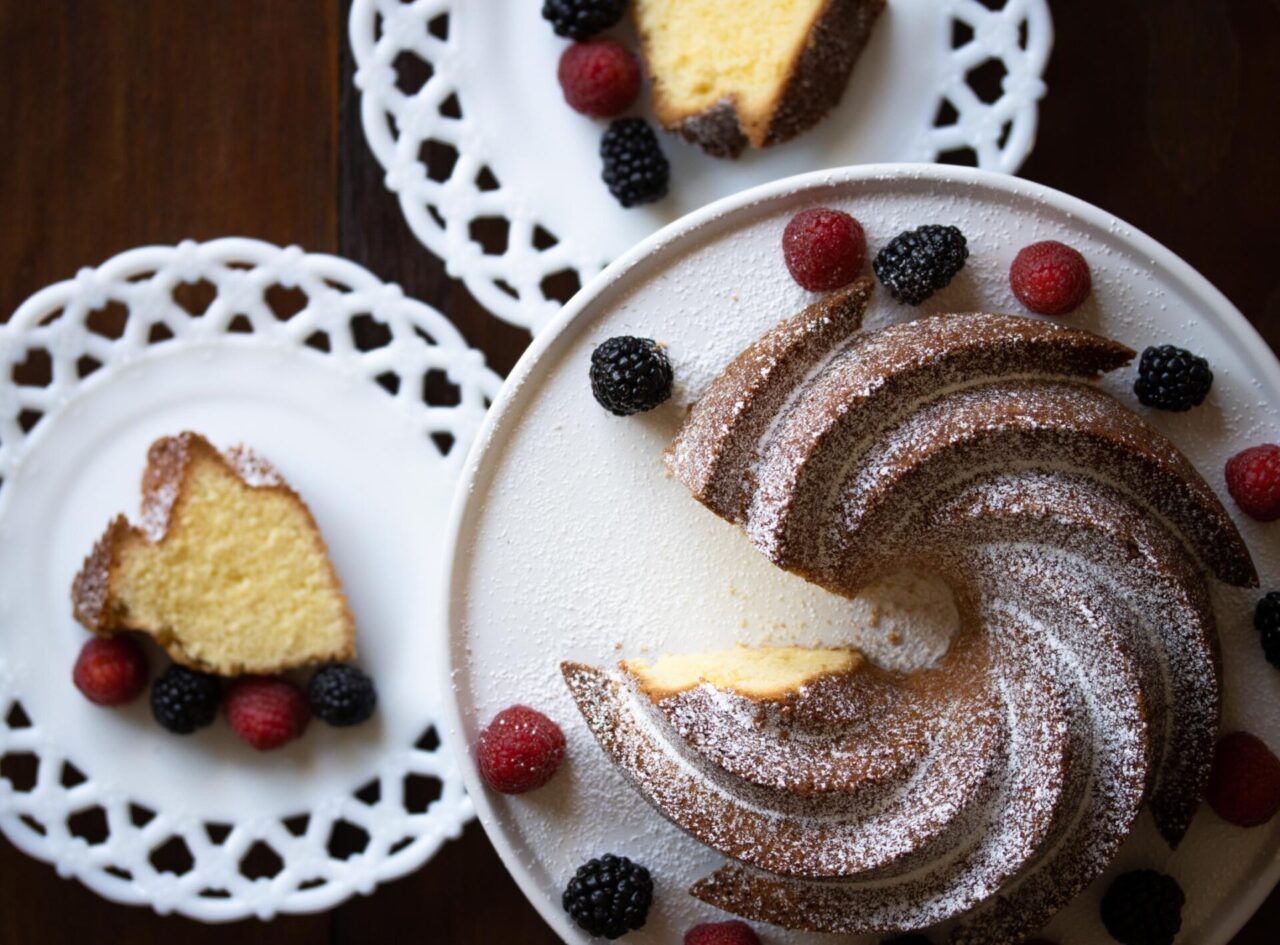 French pound cake with a slice taken in a separate serving plate.