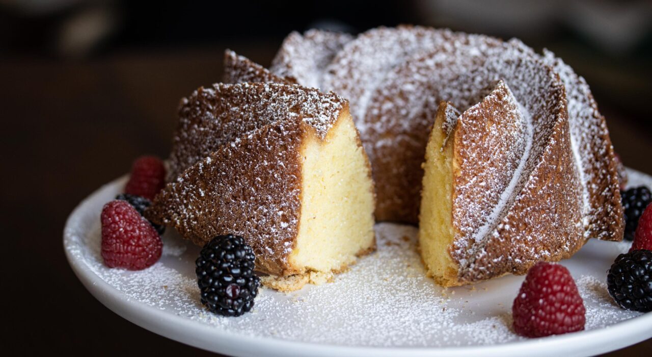 The pound cake with a slice taken.