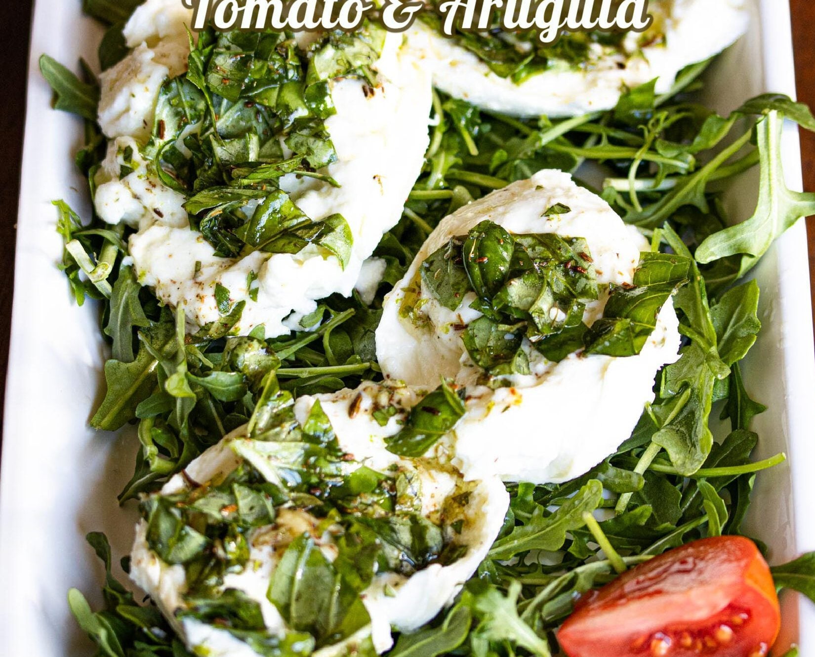 Buffalo mozzarella marinated, with tomatoes and arugula