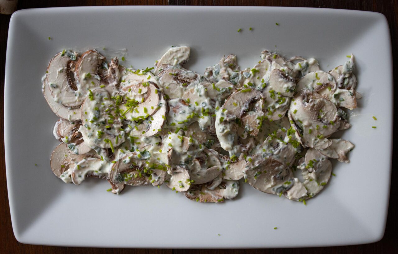 Easy Mushroom Salad With Herbs The salad served on a plate.