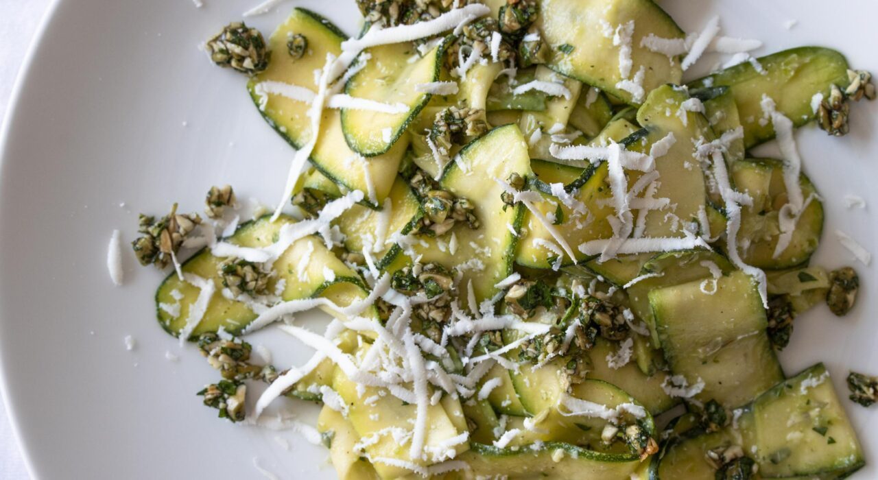 zucchini salad with avocado, gremolata in a serving plte