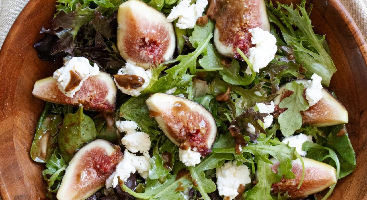 fig with goat cheese salad fig with goat cheese salad in a wooden bowl