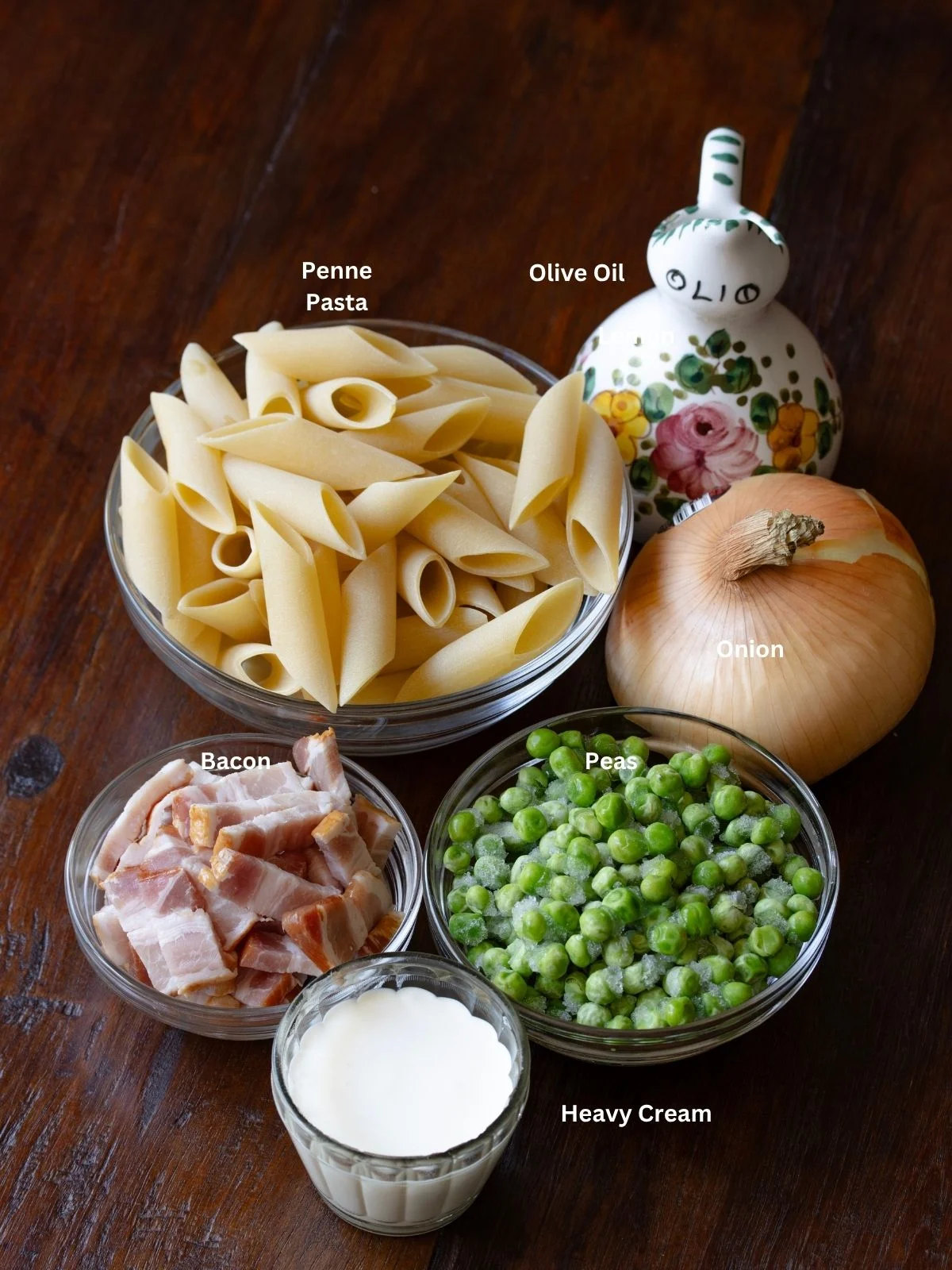 Ingredients needed to make this penne pasta with peas and bacon.