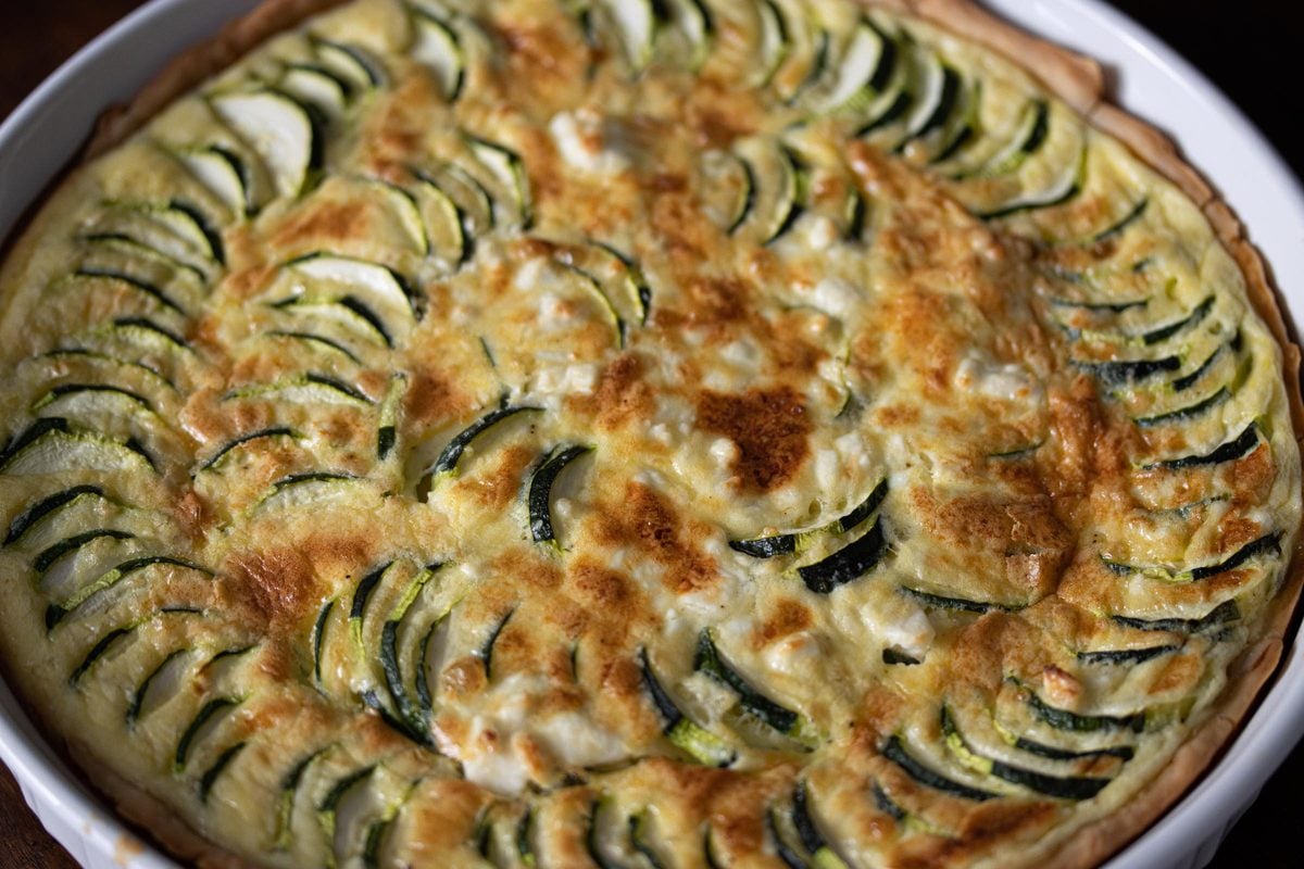 Zucchini Feta Cheese Quiche close up with the top perfectly golden. 