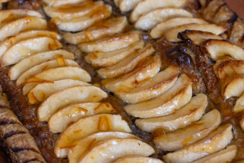 Marmelade and calvados spread over the apple frangipane tart.