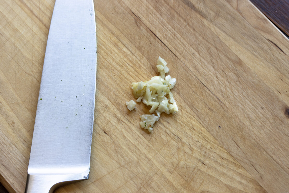 Garlic clove mashed with sea salt with the blade of a chef's knife