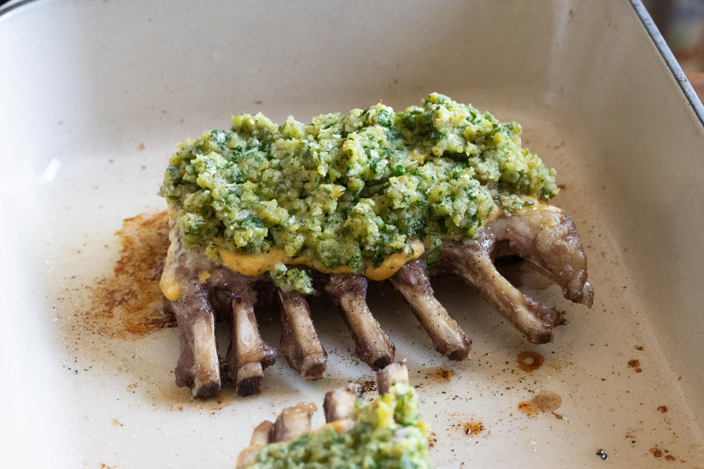 Rack of Lamb with Parsley adding the persillade to the rack