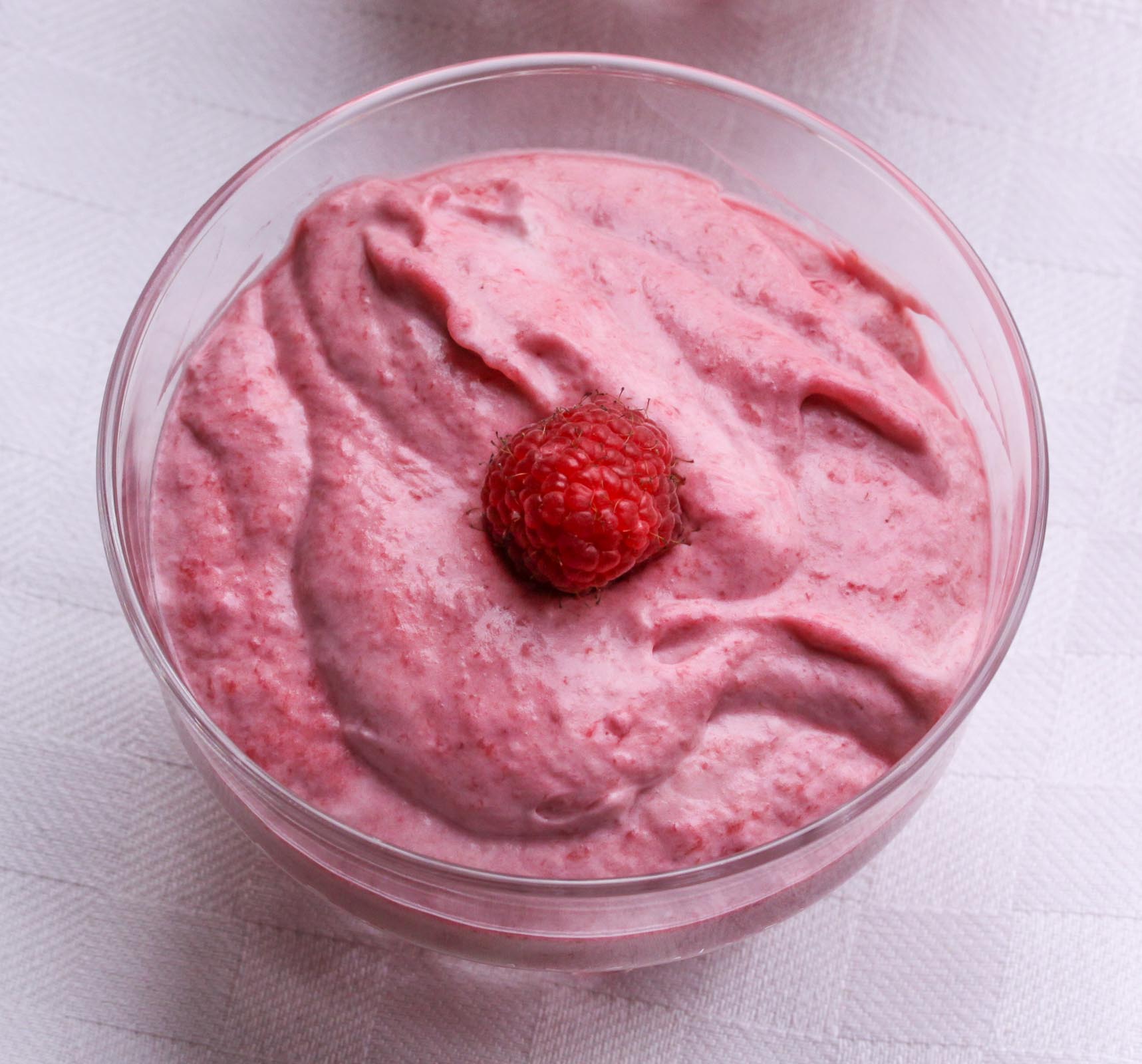 raspberry fool served in a glass container