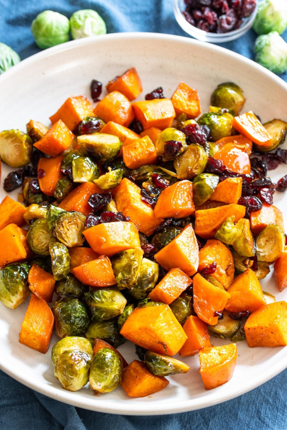 Roasted sweet potatoes served into a white round dish. 