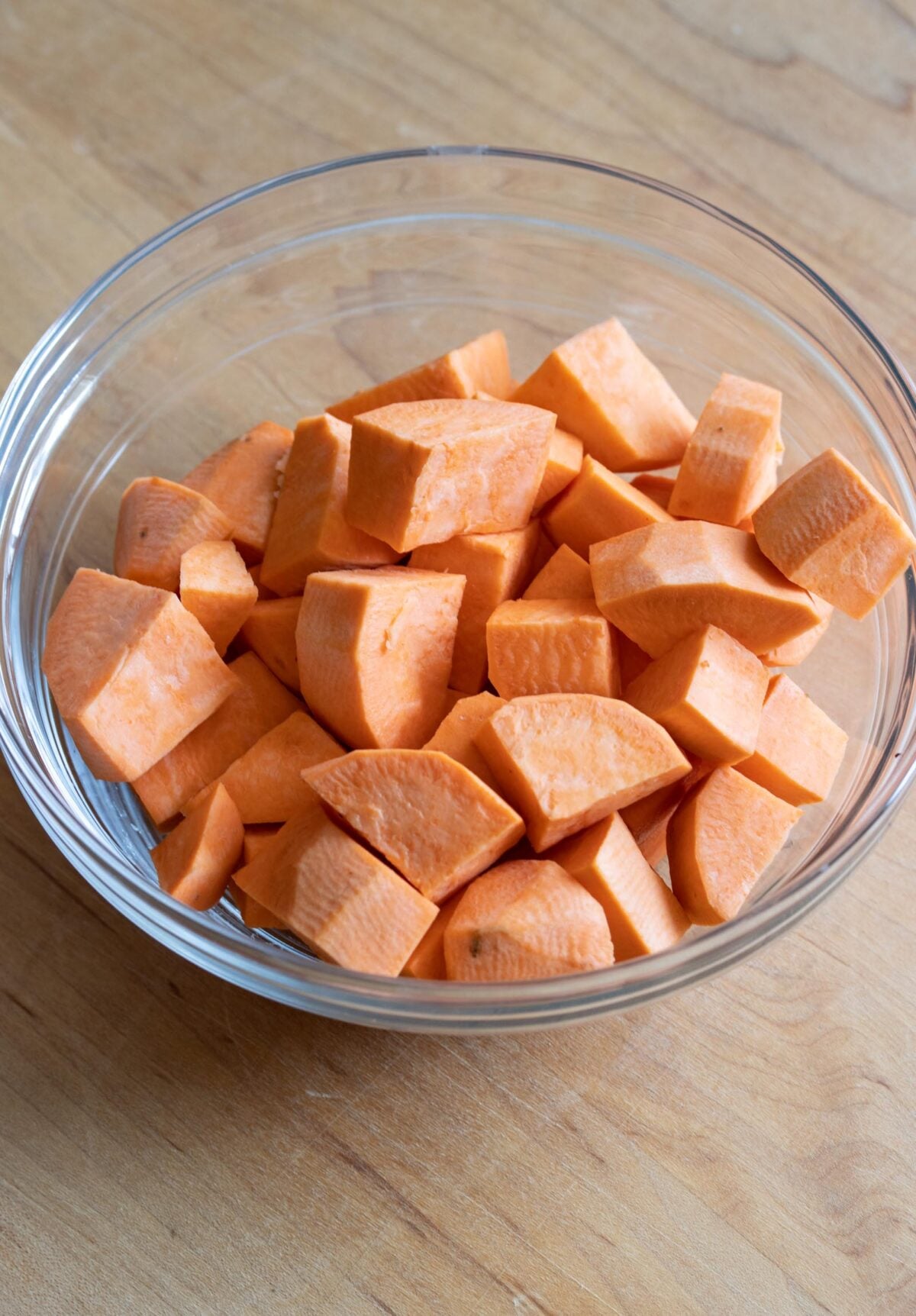 Peeled sweet potatoes and cut them into small, evenly sized cubes.