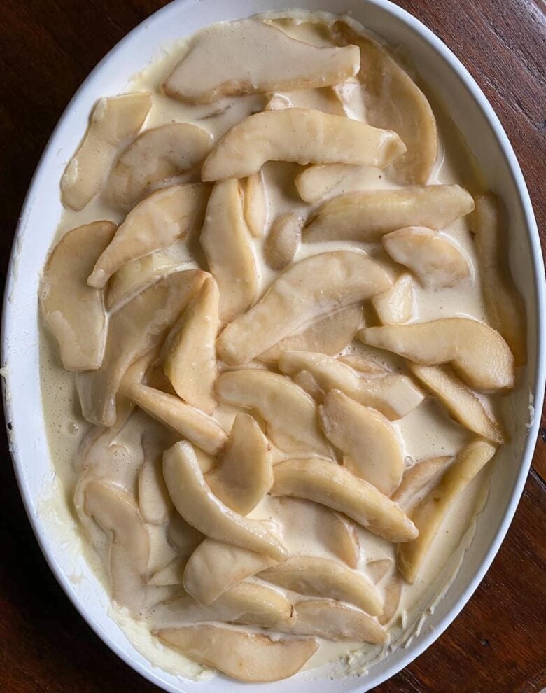 Pears with batter added to the buttered gratin dish and ready to go in the oven.