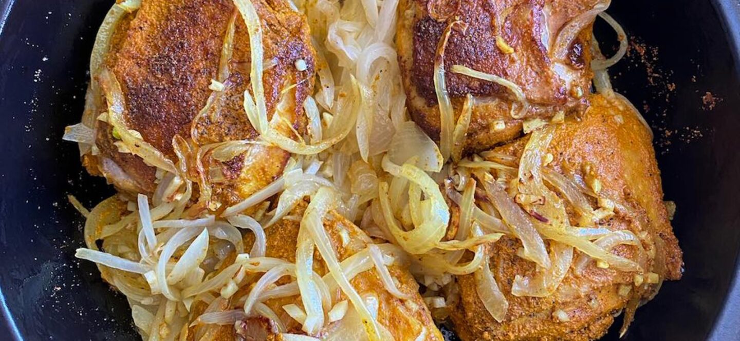 ONce the onions are sauteed, we add the marinated chicken to the tagine. 
