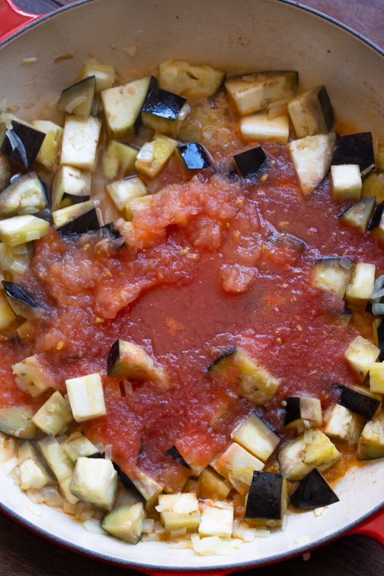 Tomato pulp added to the eggplant mixture.