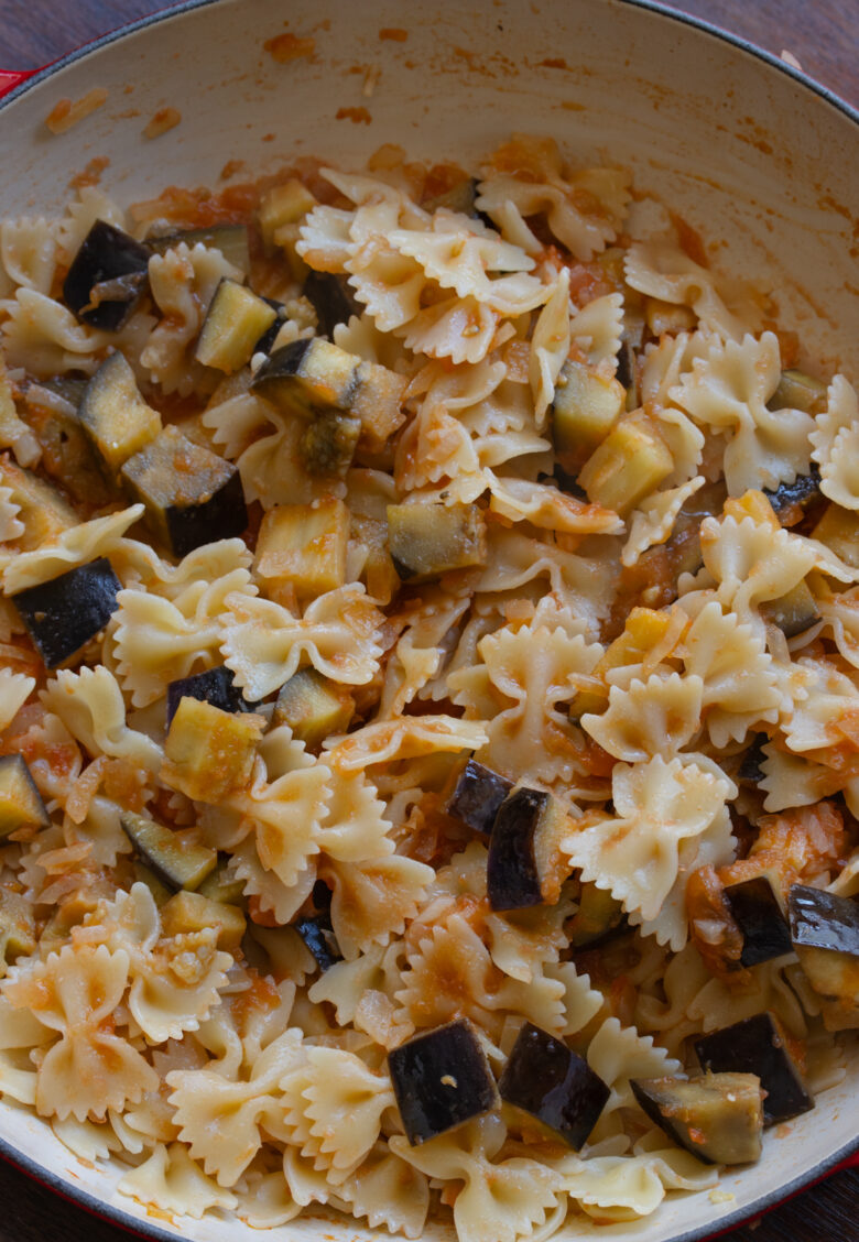 Pasta added to the skillet with the tomatoes, eggplant and onions.