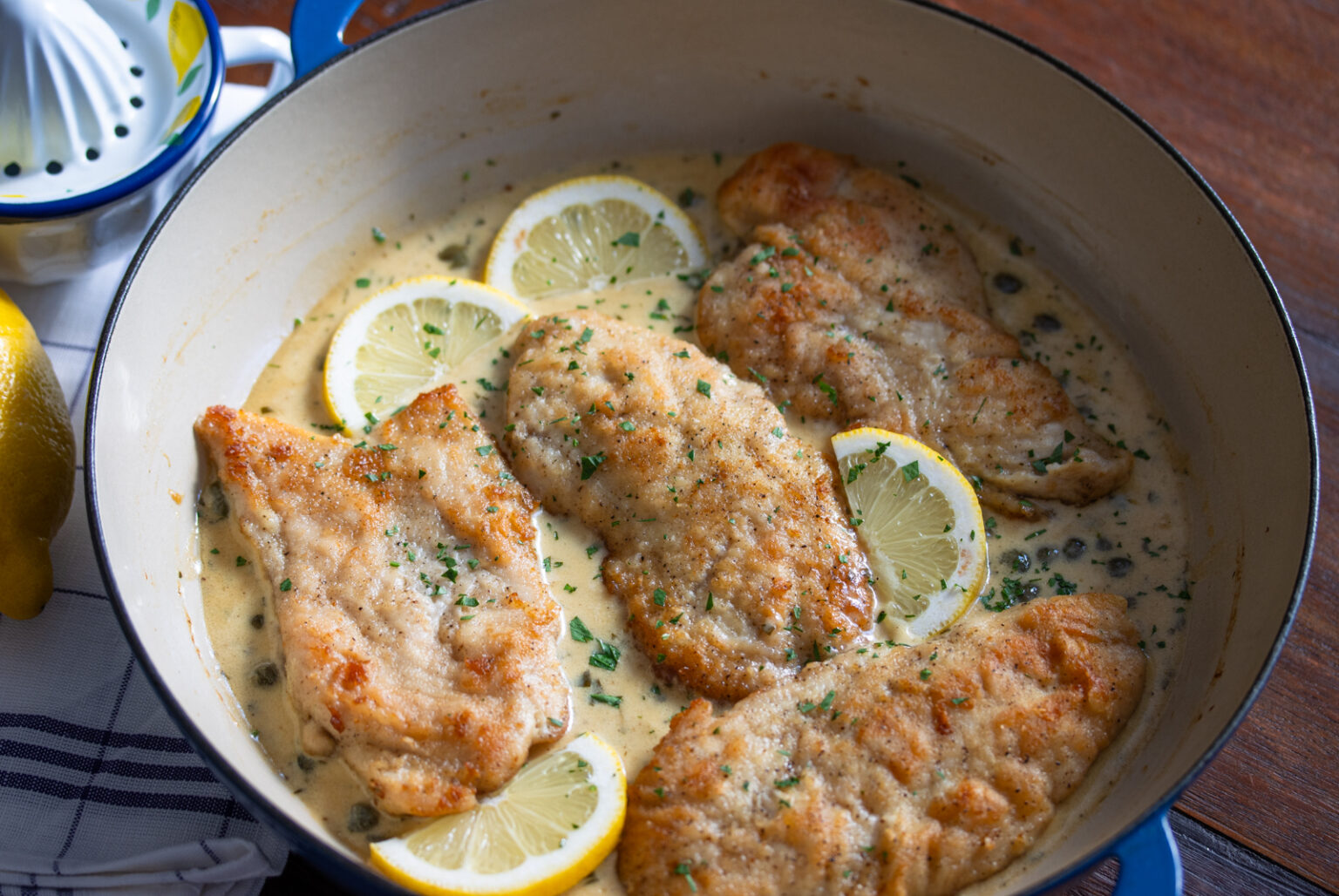 The chicken picatta in the large skillet. 