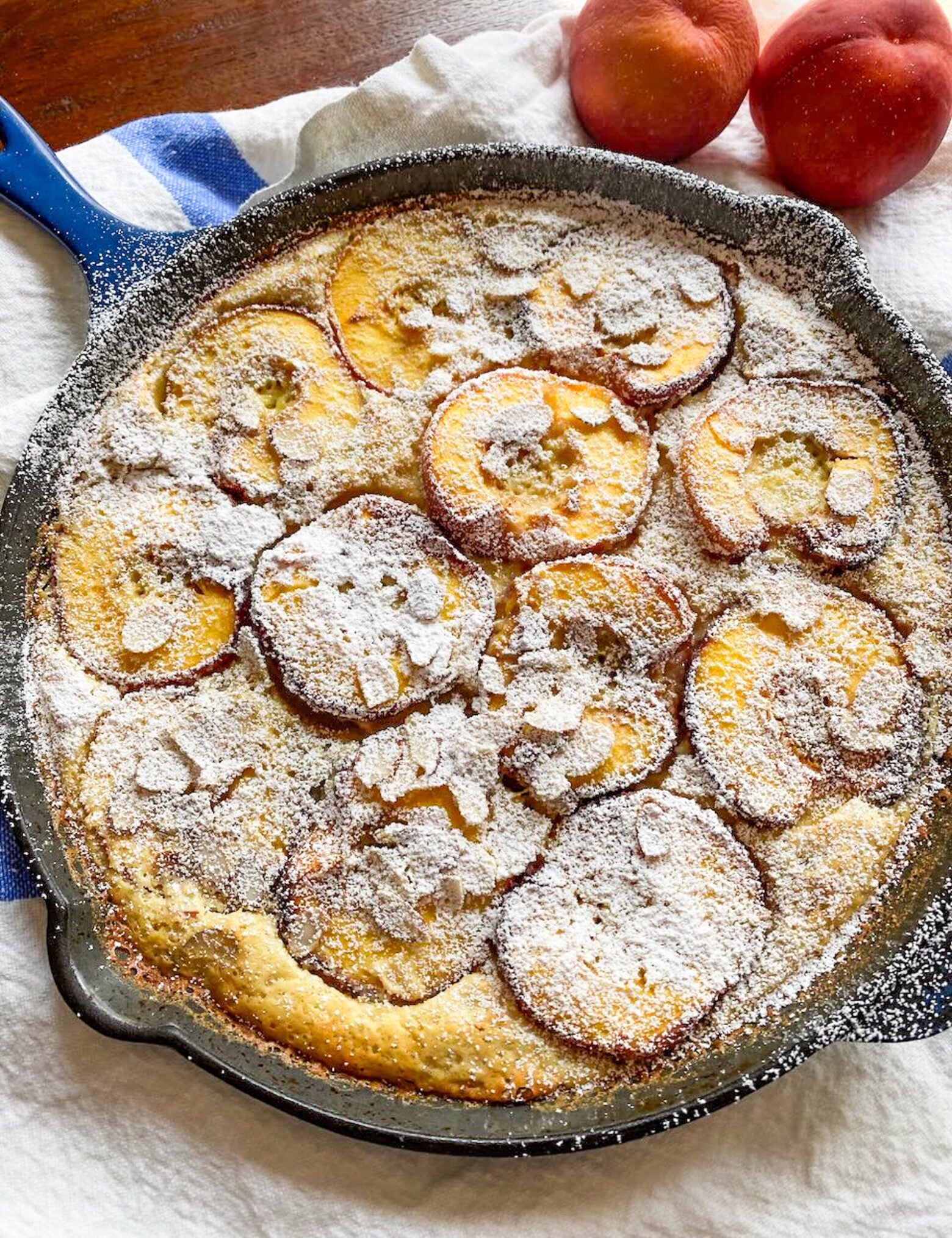 The finished recipe out of the oven in a blue enamel cast iron skillet.