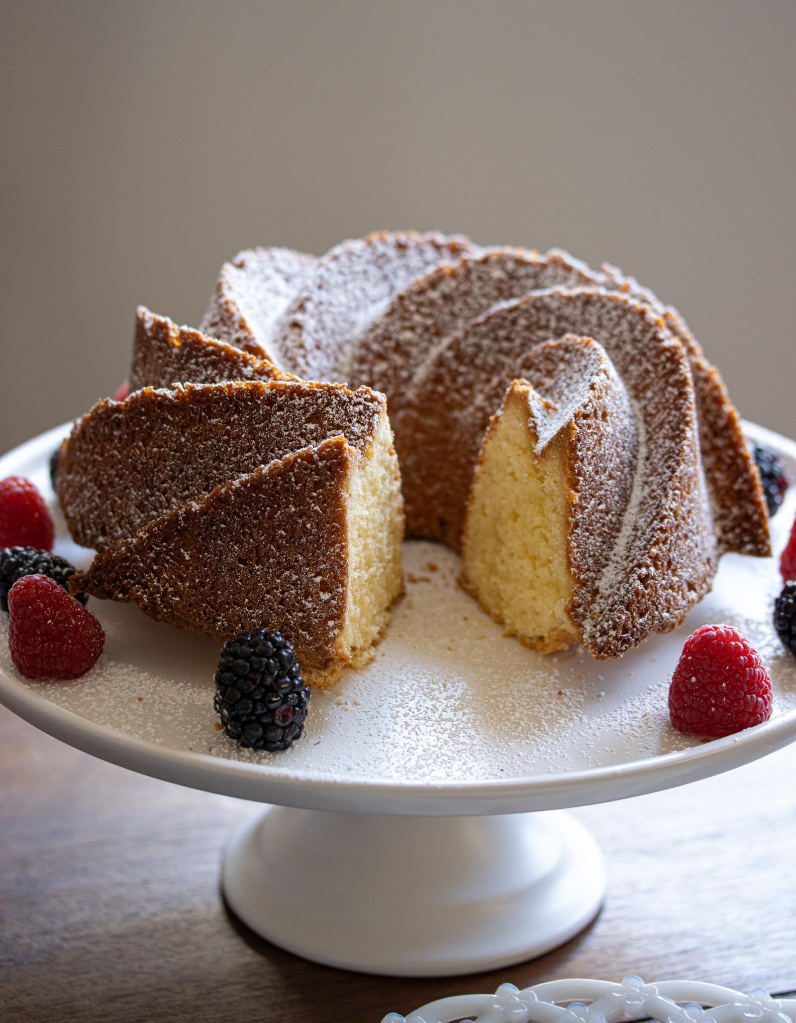 Delicious pound cake with a slice taken.