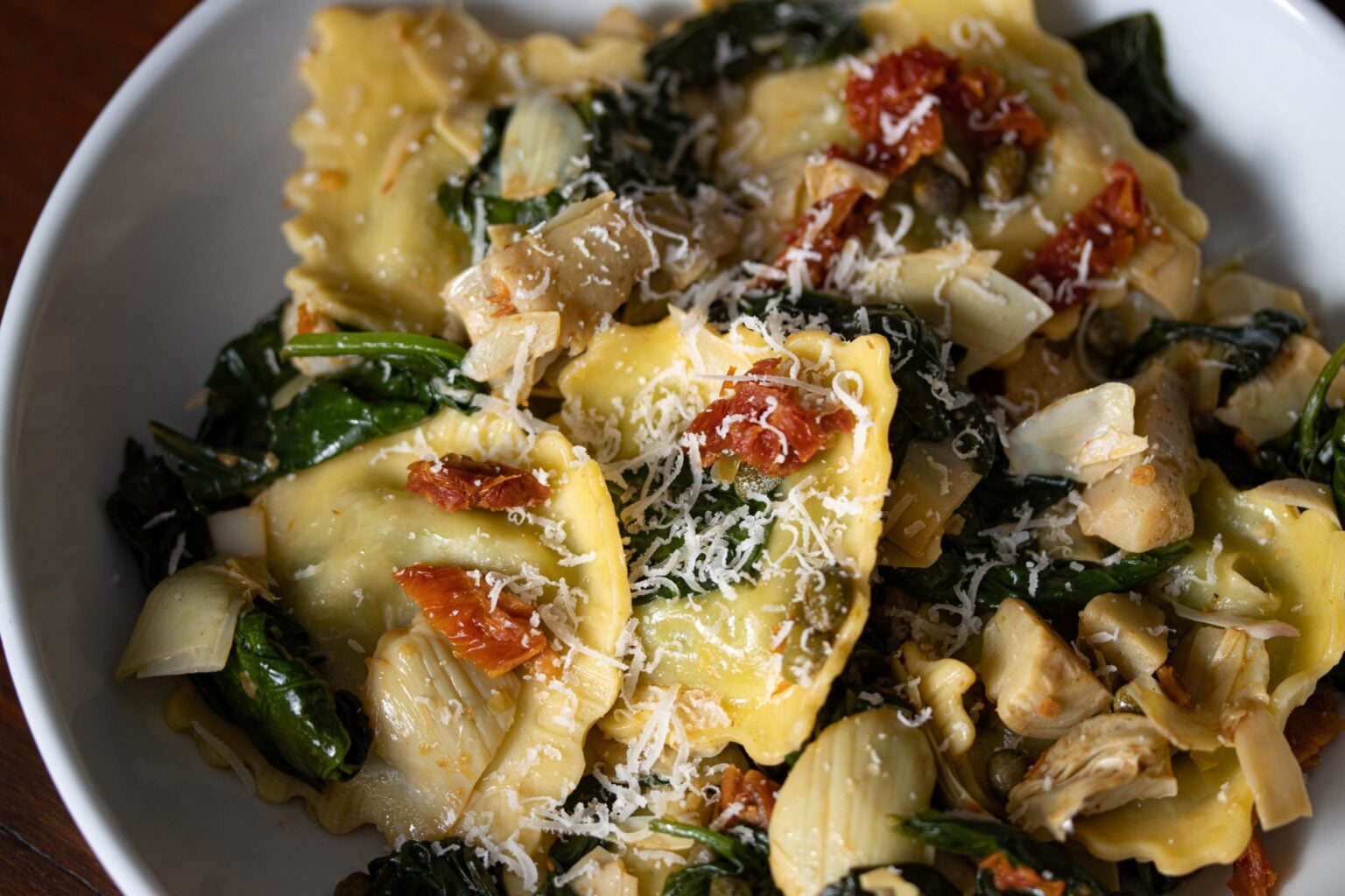 Ravioli, Artichokes hearts, sun dried tomatoes, capers and spinach