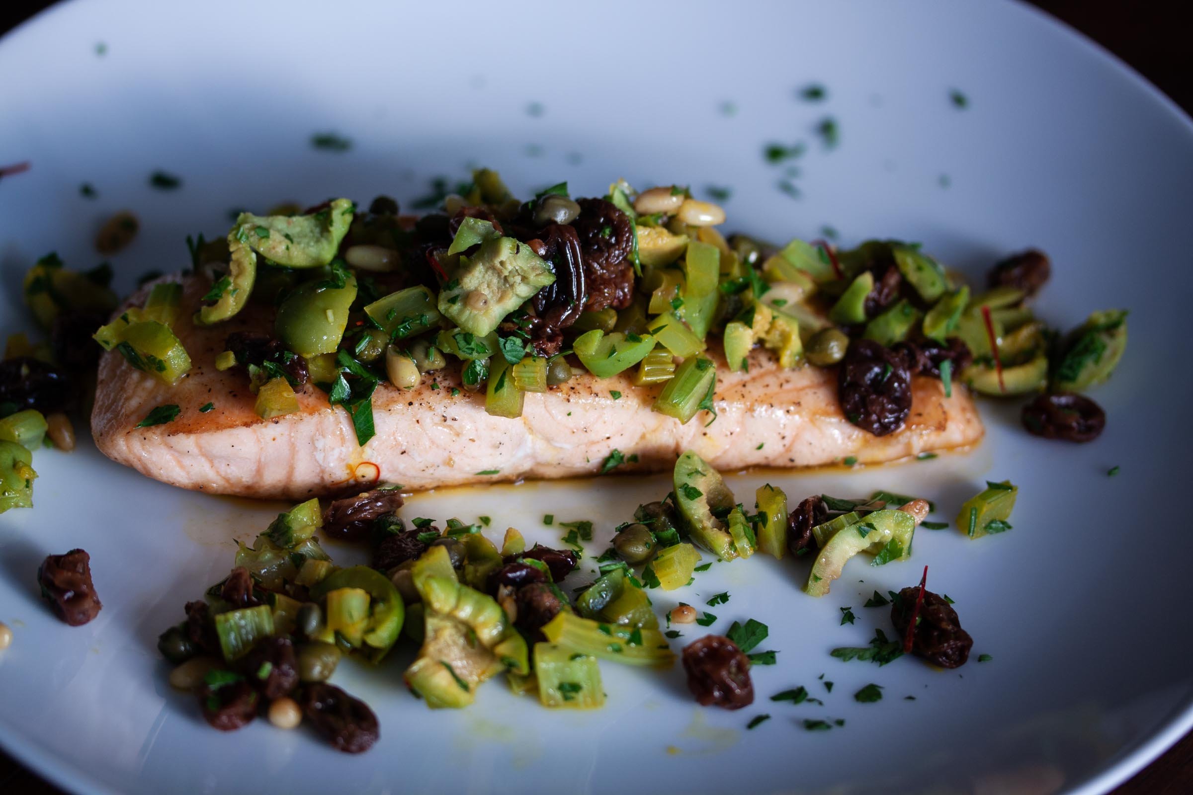 grilled salmon with olives and pine nuts